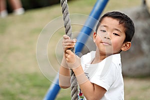 Japanese boy playing with flying fox