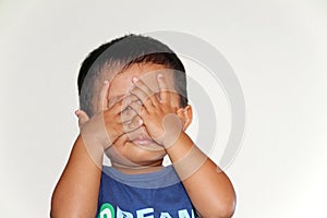 Japanese boy playing peek-a-boo