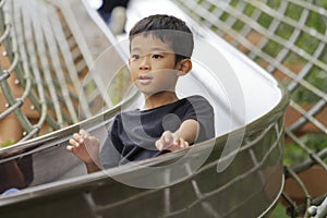 Japanese boy on the slide