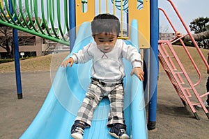 Japanese boy on the slide