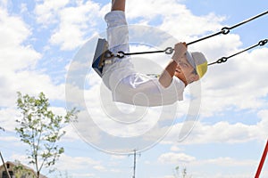 Japanese boy on the swing