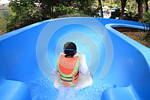 Japanese boy on the water slide