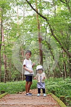 Japanese brother and sister on a hike