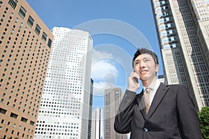 Japanese businessman talks with a mobile phone