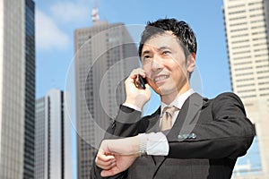 Japanese businessman talks with a mobile phone