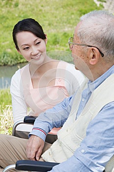 Japanese caregivers and senior speak in the field