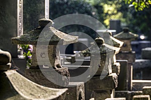 Japanese cemetery with stone lanterns