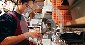 Japanese chef man, cooking and chopsticks by stove, service or catering job on heat, flame or ready. Person, restaurant