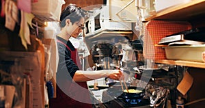 Japanese chef man, cooking and kitchen by stove, service or catering job on pan, pot and ready. Person, restaurant or