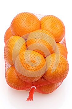 Japanese citrus mikan fruit in a plastic bag