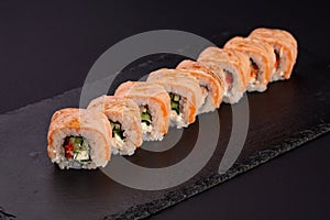Japanese cold roll with salmon on black background