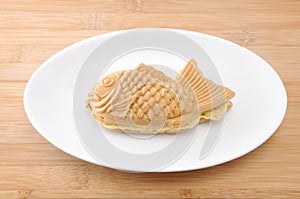 Japanese confectionery taiyaki fish cake wagashi on plate on table