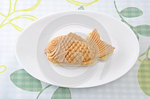 Japanese confectionery taiyaki fish pancake wagashi on plate on table