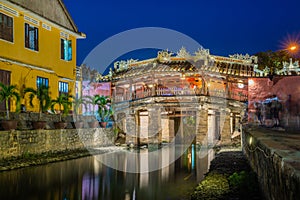 Japanese Covered ancient Bridge and River in Street in Old city of Hoi An in Southeast Asia in Vietnam. Vietnamese heritage and