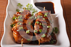 Japanese cuisine: chicken yakitori on skewers close-up. horizontal