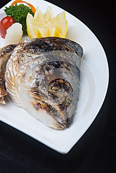 japanese cuisine. fried fish head on the background