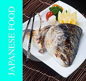 japanese cuisine. fried fish head on the background