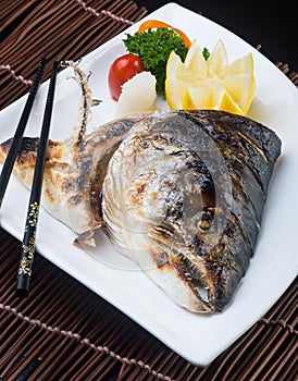 Japanese cuisine. fried fish head on the background
