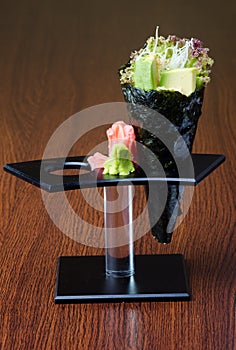 japanese cuisine. hand roll on the background