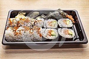 Japanese Cuisine: Tasty Uramaki , Futomaki and temaki served in the take-away box