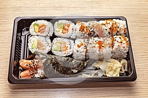 Japanese Cuisine:Tasty Uramaki , Futomaki and temaki served in the take-away box