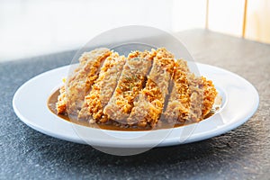 Japanese curry with fried pork cutlet tonkatsu photo