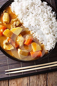 Japanese curry with rice Kare Raisu close-up. Vertical top vie