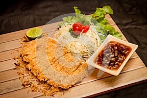 Japanese deep fried breaded fish cutlet with lime and ponzu sauce