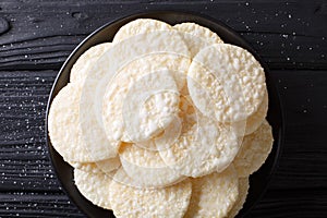 Japanese dessert rice cakes with sugar close-up on a plate. horizontal top view