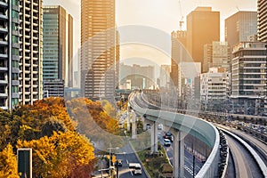 Japanese Destinations. Distant Monorail Train Approaching to Station In Tokyo City in Japan photo