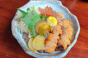 Japanese dining uni bowl with ikura and egg