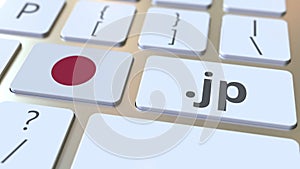 Japanese domain .jp and flag of Japan on the buttons on the computer keyboard. National internet related 3D animation