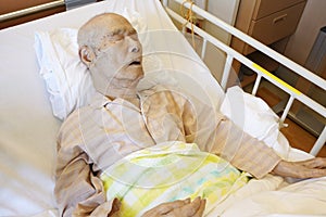 Japanese elderly man patient lying, sleeping