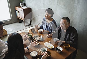 Japanese family dining together with happiness