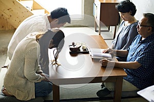 Japanese family greeting bowing with senior