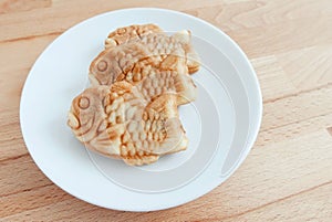 Japanese fish-shaped cake Taiyaki on the plate