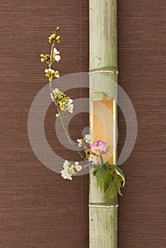 Japanese flower arrangement in bamboo