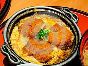 Japanese food called Katsudon in hot pan