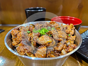 Japanese food called Tori Don or Chicken Rice Bowl served with miso soup and fried egg roll