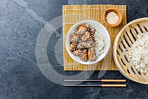 Japanese food. Chicken teriyaki with rice. slate background, top view