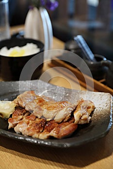 Japanese food , Chicken teriyaki with rice on wooden table