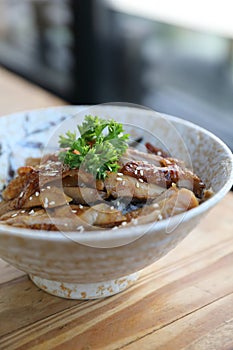 Japanese food , Chicken teriyaki with rice on wooden table