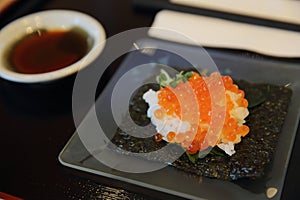 Japanese food ikura sushi , salmon roll with rice photo