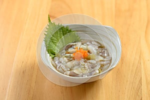 japanese food Octopus Tako Wasabi served in a bowl isolated on wooden table top view