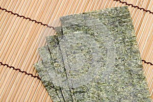 Japanese food, pile of nori dry seaweed sheets photo