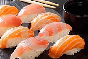 Japanese food: a set of sushi with salmon and tuna, soy sauce cl