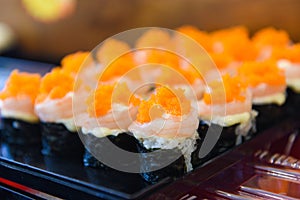 Japanese food shrimp sushi roll rice with tobiko egg is orange flying fish roe nori in the restaurant sushi menu set japanese