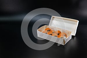 Japanese food, sushi roll cardboard box for fast food. White paper food box. Cardboard products. delivery box. Copy space. Black