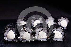 Japanese food, sushi rolls in black caviar