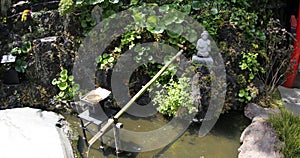 Japanese fountain and stone statue